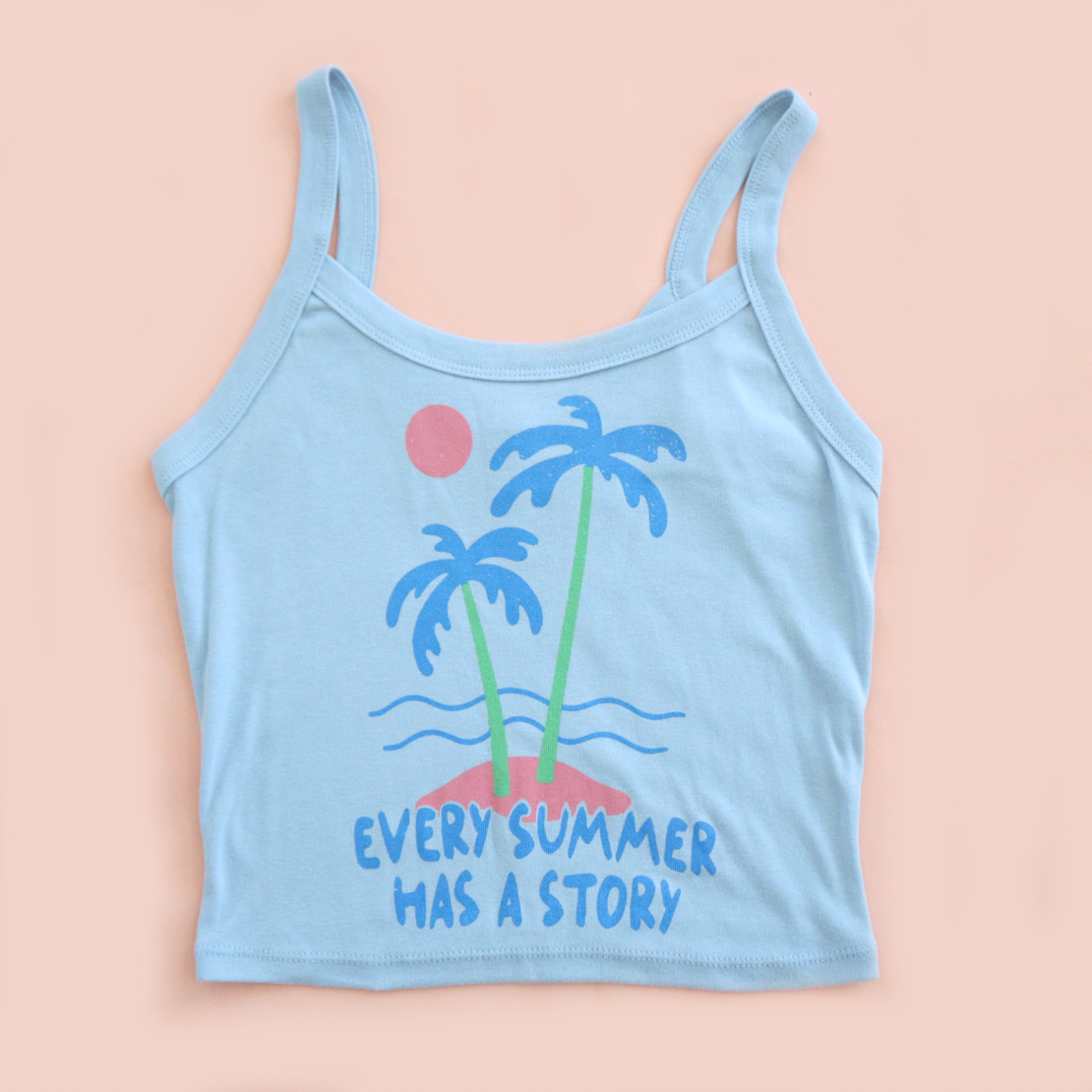 Light blue tank top with palm tree design and 'Every Summer Has a Story' text on a beige background